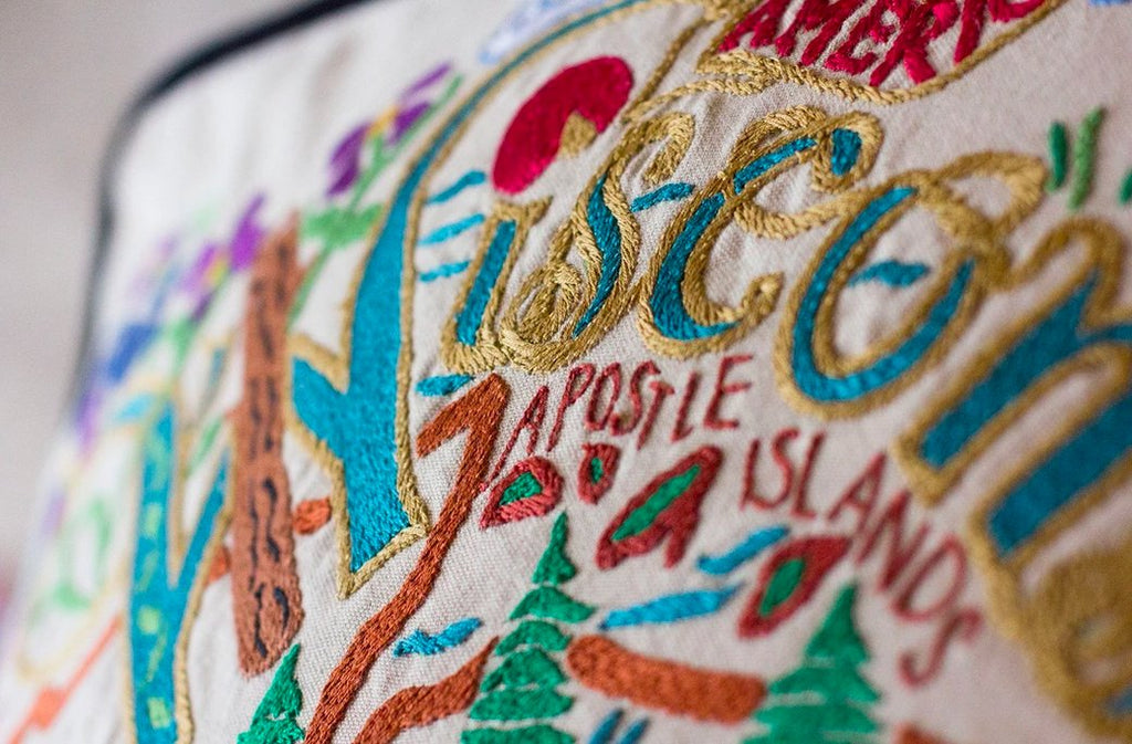 catstudio - Wisconsin Pillow - Capturing the essence of a place, each of our geography collection pillows is EMBROIDERED by HAND on 100% organic cotton.
